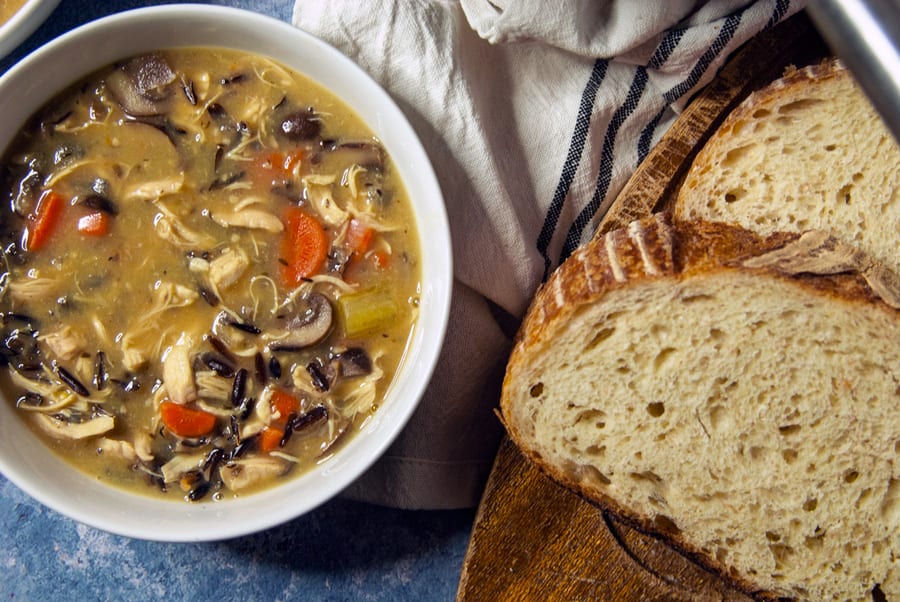 Creamy Chicken and Wild Rice Soup in Bowls served with Bread