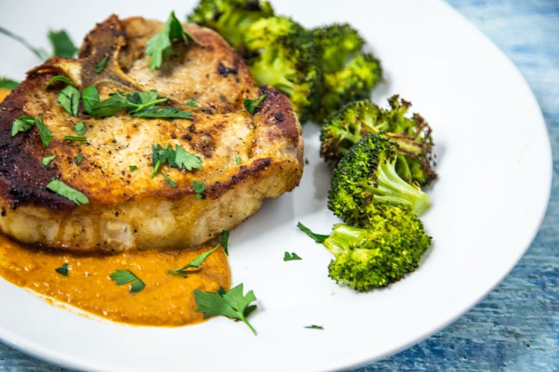 Pork Chop on White Plate with Broccoli