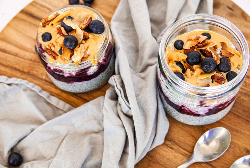 Overhead photo of two jars filled with chia pudding and granola