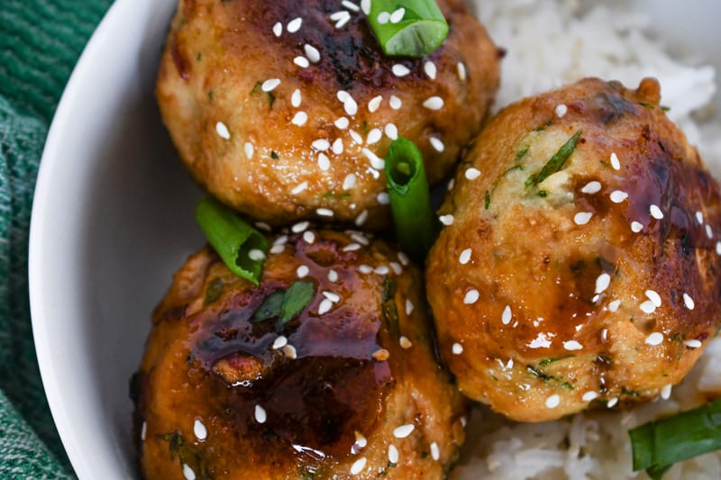 Close up of Picture of Asian Chicken Meatballs over Rice