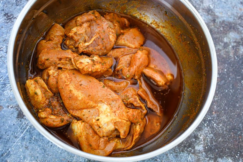 Sheet Pan Chicken Shawarma Marinating in mixing bowl 