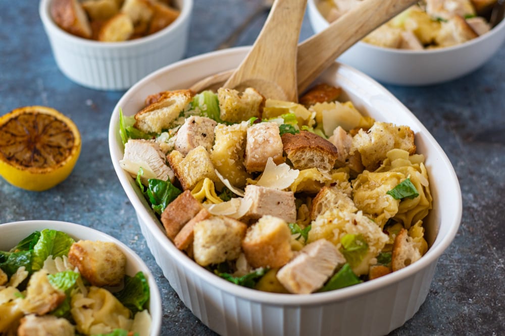 Caesar Tortellini Salad with serving spoons 