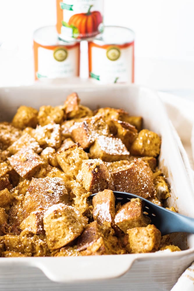 Pumpkin Bread PUdding with pumpkin in the background