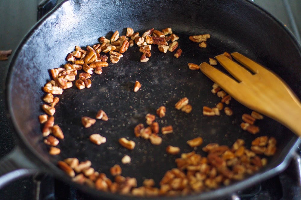 Toasting pecans in a cast iron Skillet for Shredded Brussel Sprout Salad