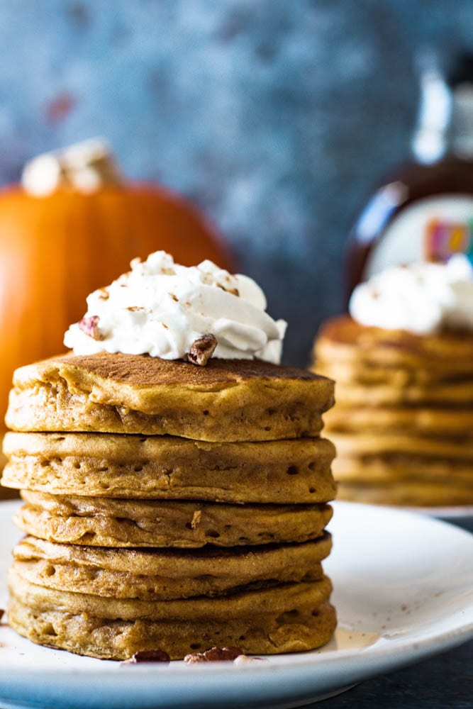 Stacked picture of whole wheat pumpkin pancakes Thanksgiving Breakfast Ideas