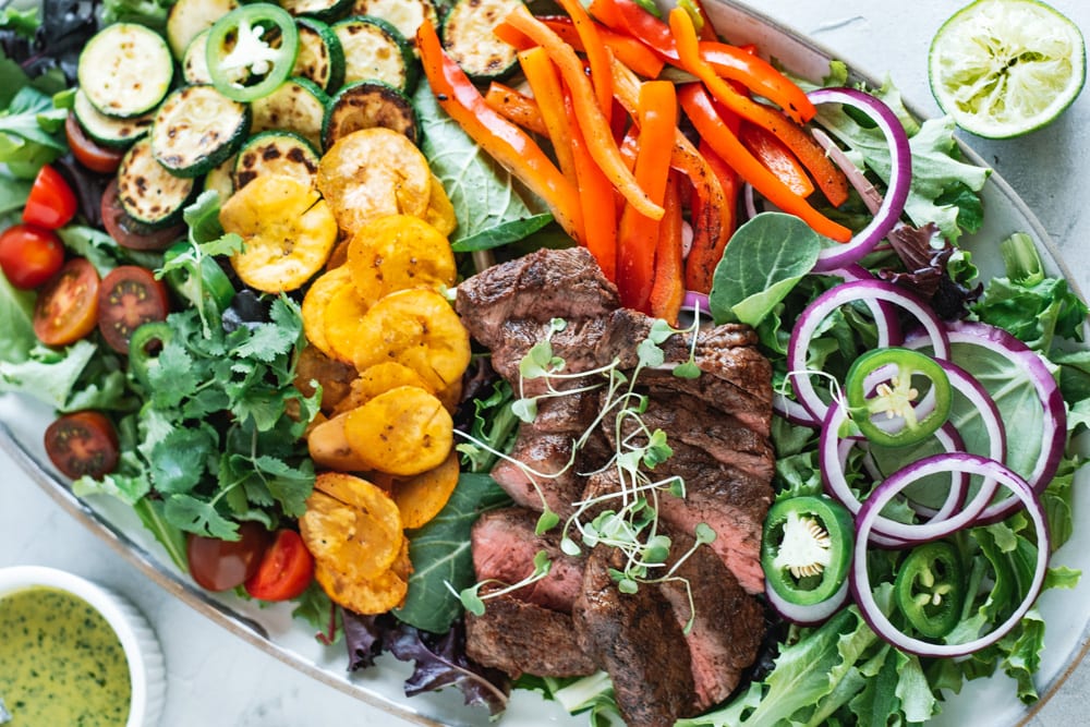 Over had shot of Steak Taco Salad with Cilantro Vinaigrette